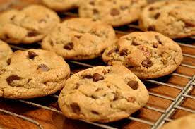 6 golden brown chocolate chip cookies in the oven
